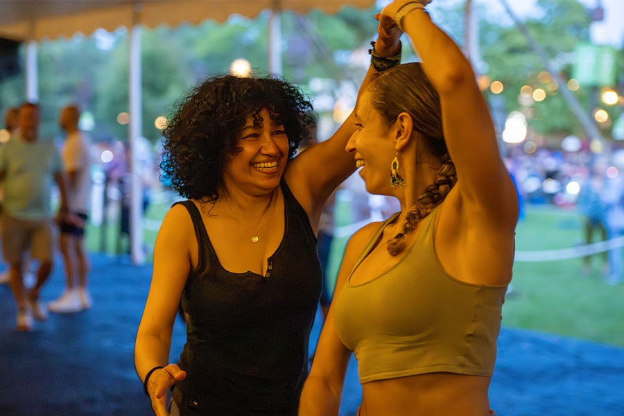 Two concertgoers enjoying the Lawn dance floor